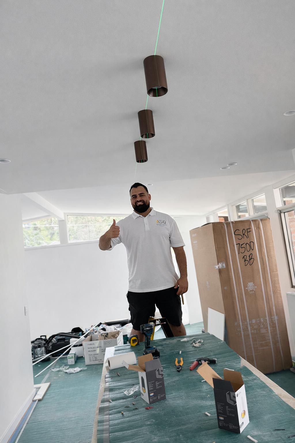 Ammar installing pendant lights